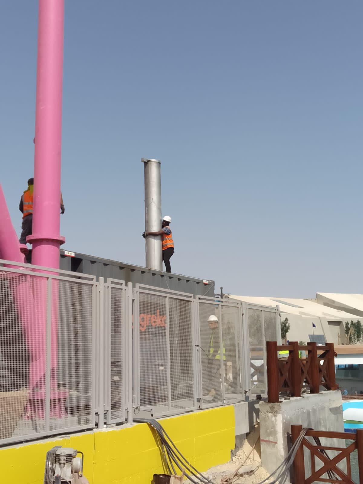 Site operative beside generator equipment